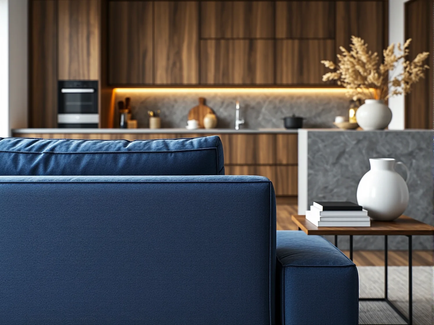 Narożnik ustawiony tyłem do kuchni jako optyczna przegroda w przestronnym salonie